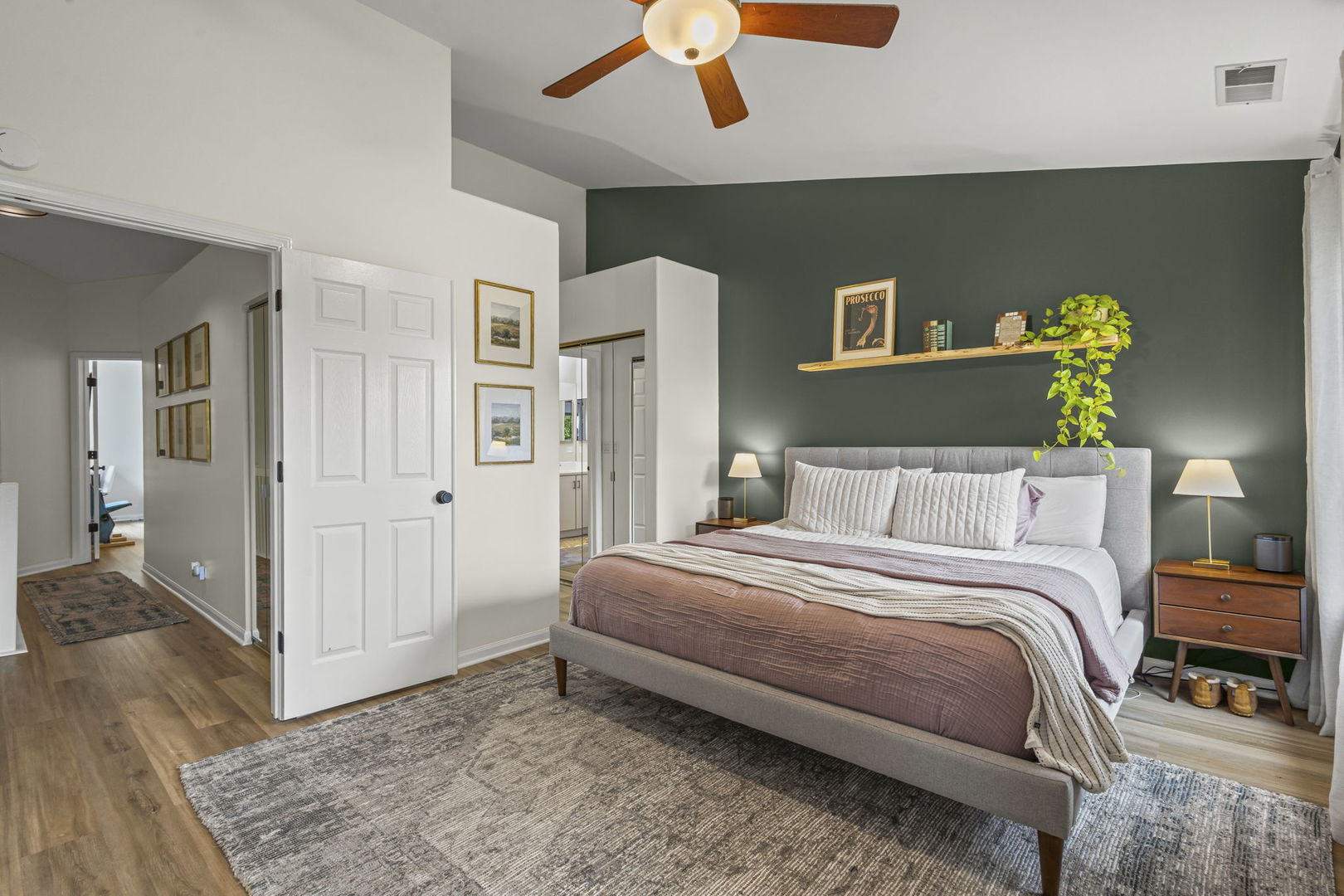 111 Cathy Lane Mount Prospect, IL 60056 - Photo 20 of 36 a bedroom with a bed and a chandelier