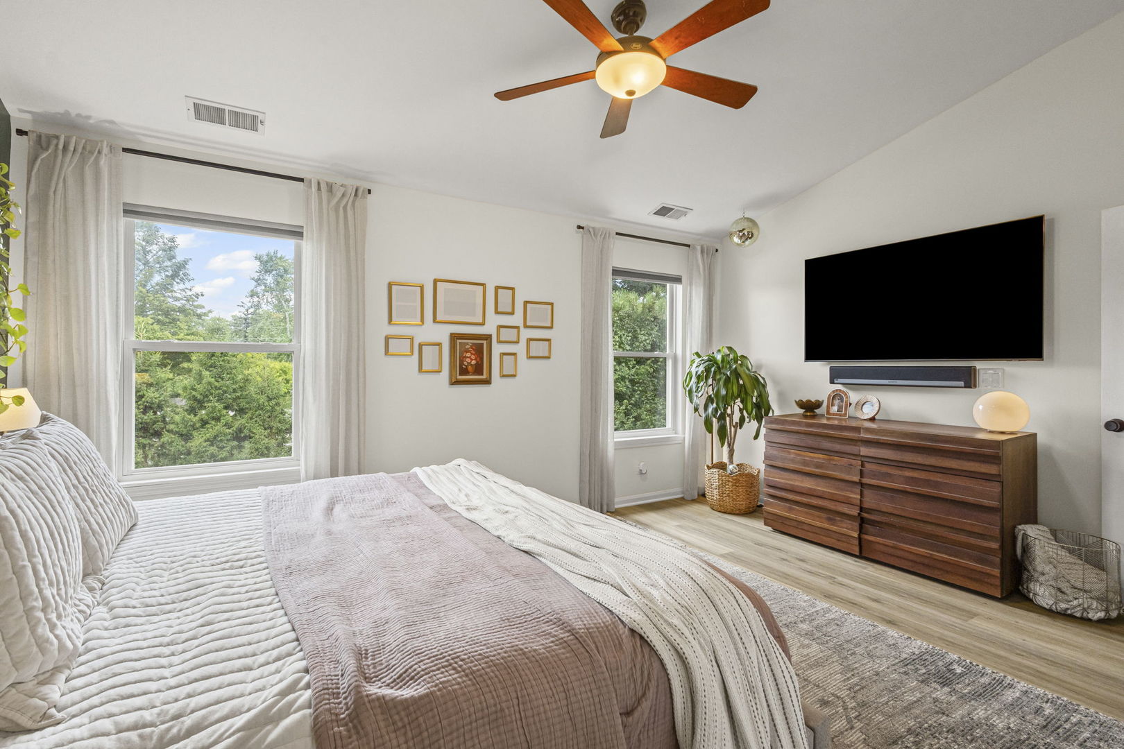 111 Cathy Lane Mount Prospect, IL 60056 - Photo 22 of 36 a bedroom with a bed and a flat screen tv