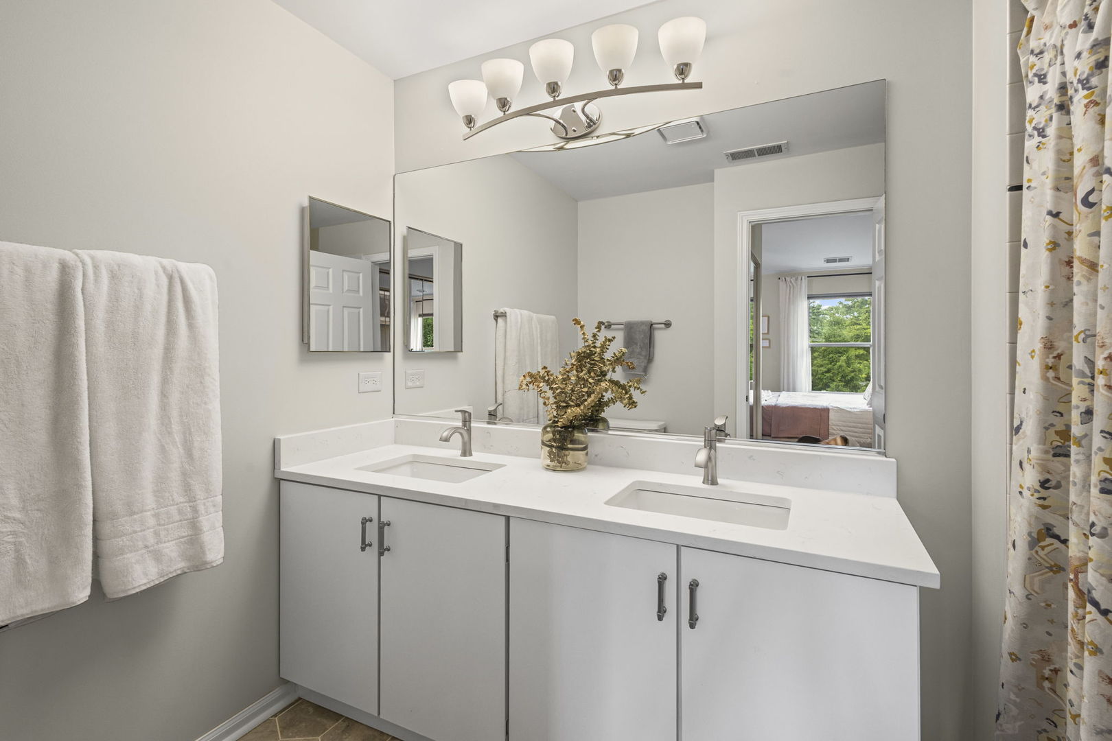 111 Cathy Lane Mount Prospect, IL 60056 - Photo 23 of 36 a bathroom with a sink and a mirror