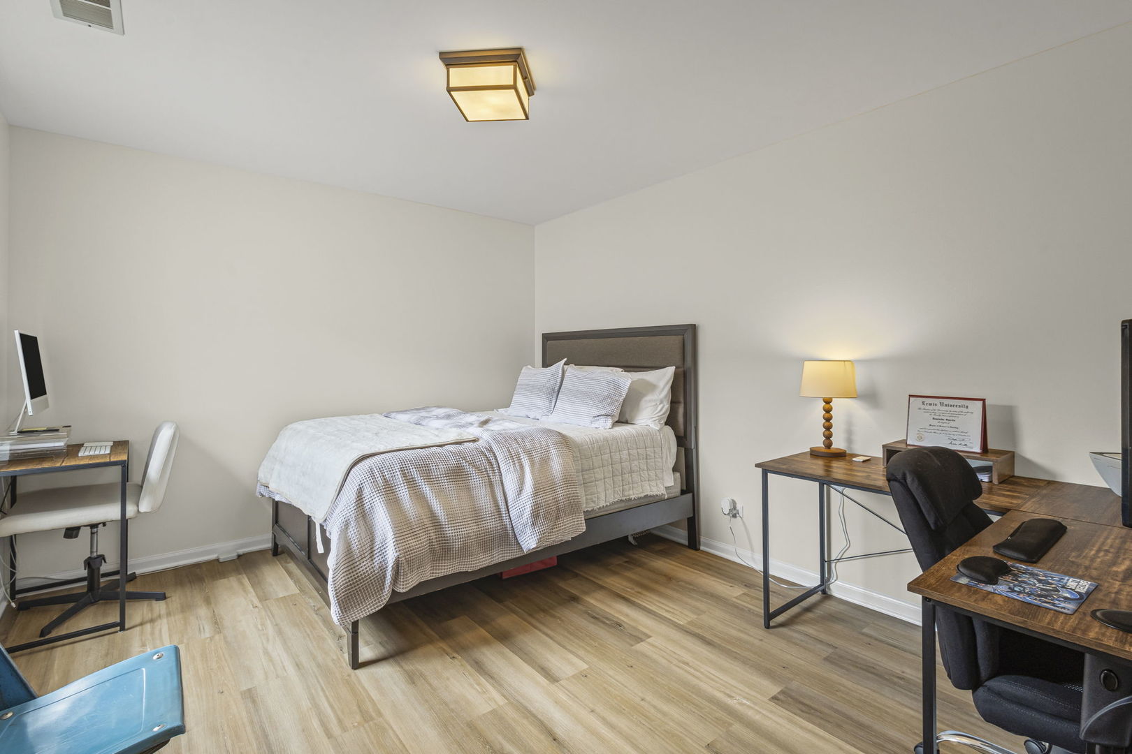 111 Cathy Lane Mount Prospect, IL 60056 - Photo 25 of 36 a bedroom with a bed and a desk