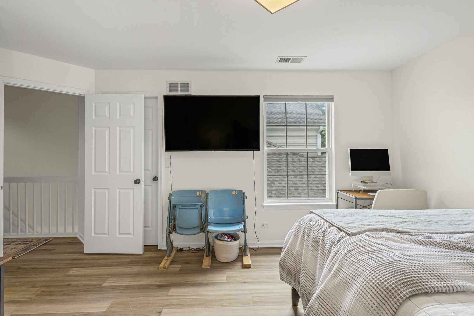 111 Cathy Lane Mount Prospect, IL 60056 - Photo 27 of 36 a bedroom with a bed a flat screen tv and a fireplace