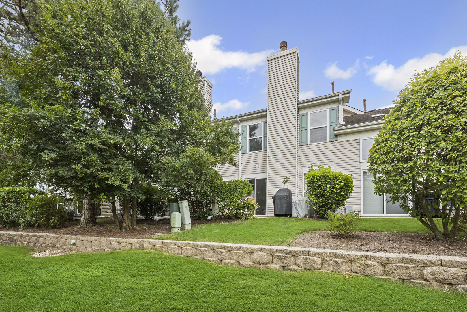 111 Cathy Lane Mount Prospect, IL 60056 - Photo 30 of 36 a front view of a house with a yard
