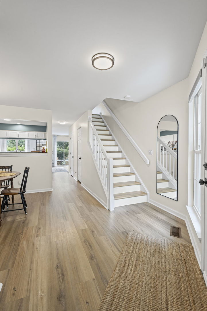 111 Cathy Lane Mount Prospect, IL 60056 - Photo 3 of 36 a view of a livingroom with wooden floor and furniture