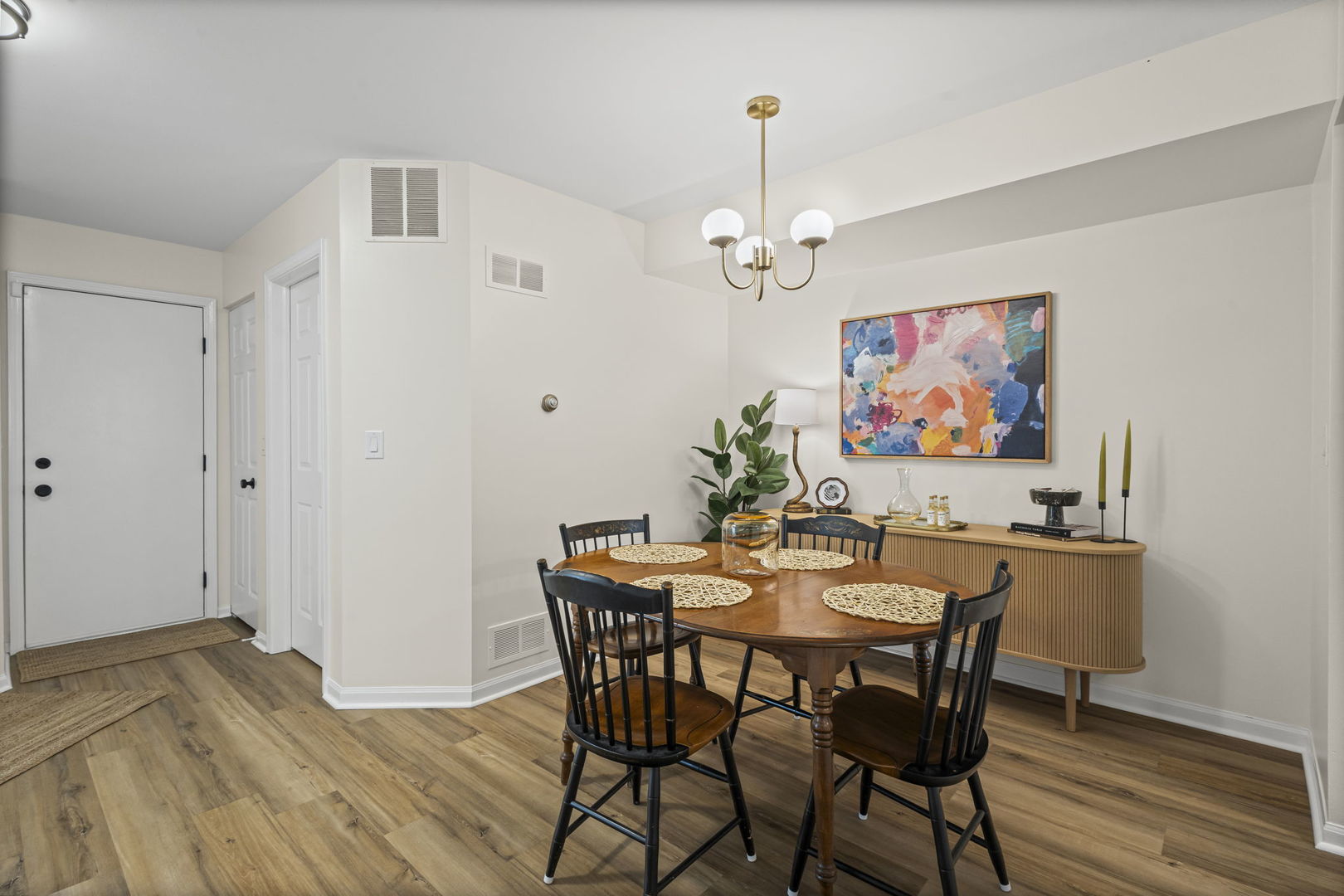 111 Cathy Lane Mount Prospect, IL 60056 - Photo 5 of 36 a view of a dining room with furniture wooden floor and a chandelier