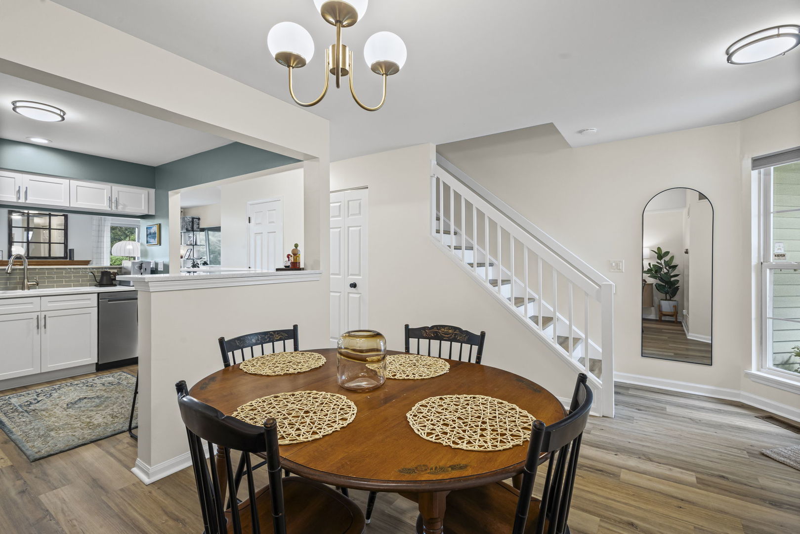 111 Cathy Lane Mount Prospect, IL 60056 - Photo 6 of 36 a view of a dining room with furniture wooden floor and chandelier