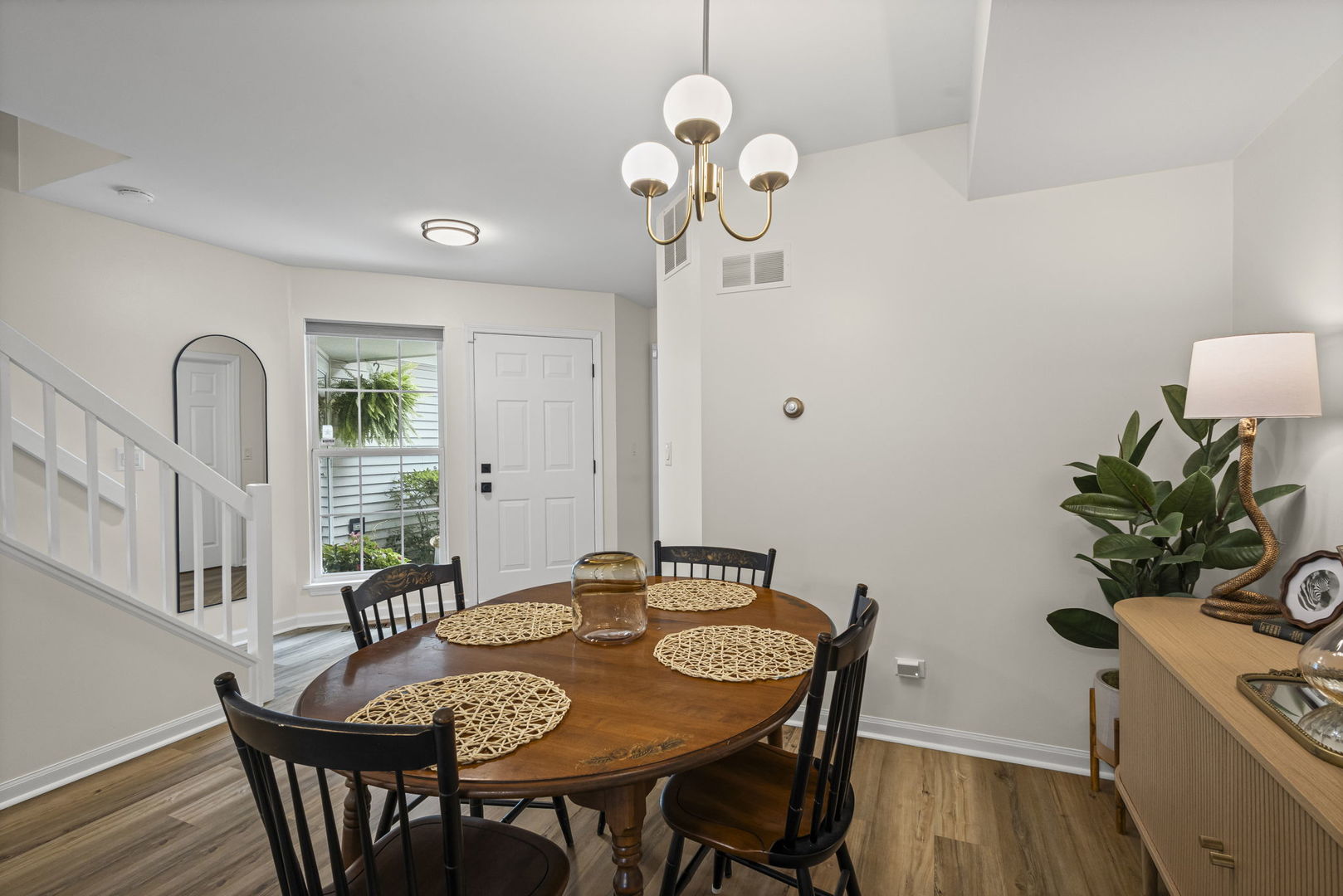 111 Cathy Lane Mount Prospect, IL 60056 - Photo 7 of 36 a view of a dining room with furniture and wooden floor