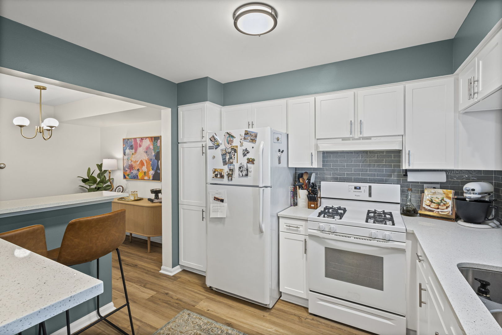 111 Cathy Lane Mount Prospect, IL 60056 - Photo 9 of 36 a kitchen with stainless steel appliances a stove a refrigerator and a cabinets