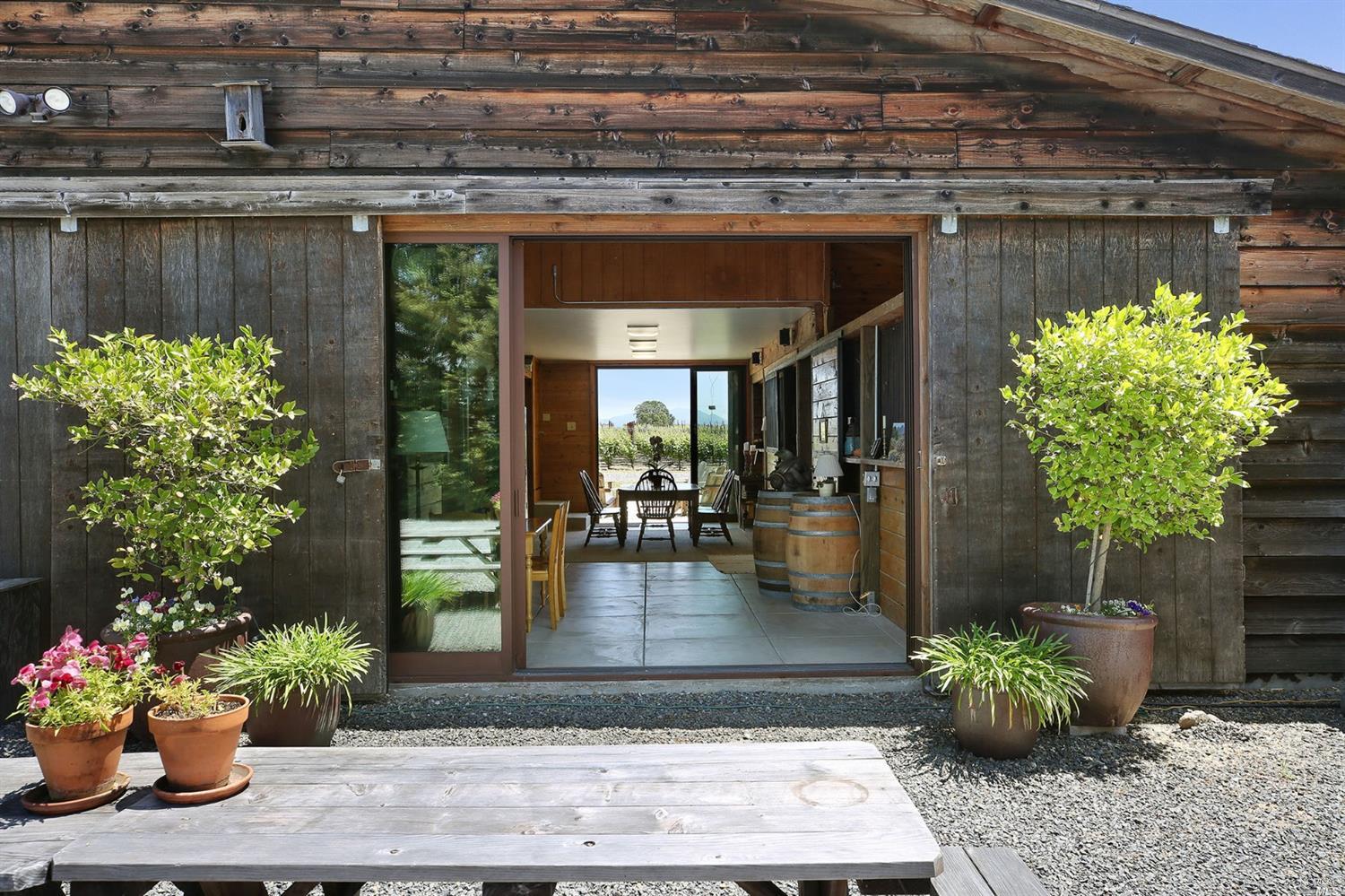 a view of a entryway of the house with flower pots