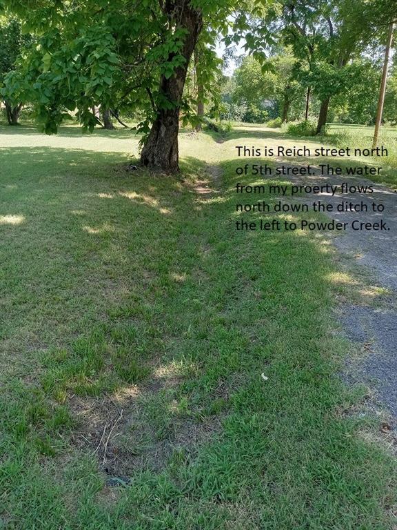 207 South 5th Street Bonham, TX 75418 - Photo 1 of 14 a view of green field with trees in the background