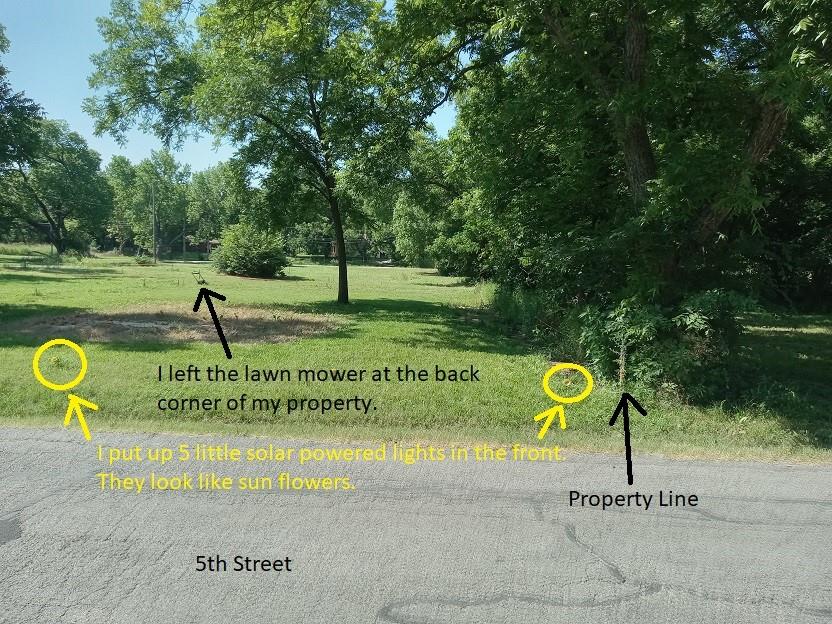 207 South 5th Street Bonham, TX 75418 - Photo 4 of 14 a sign board with garden in the background