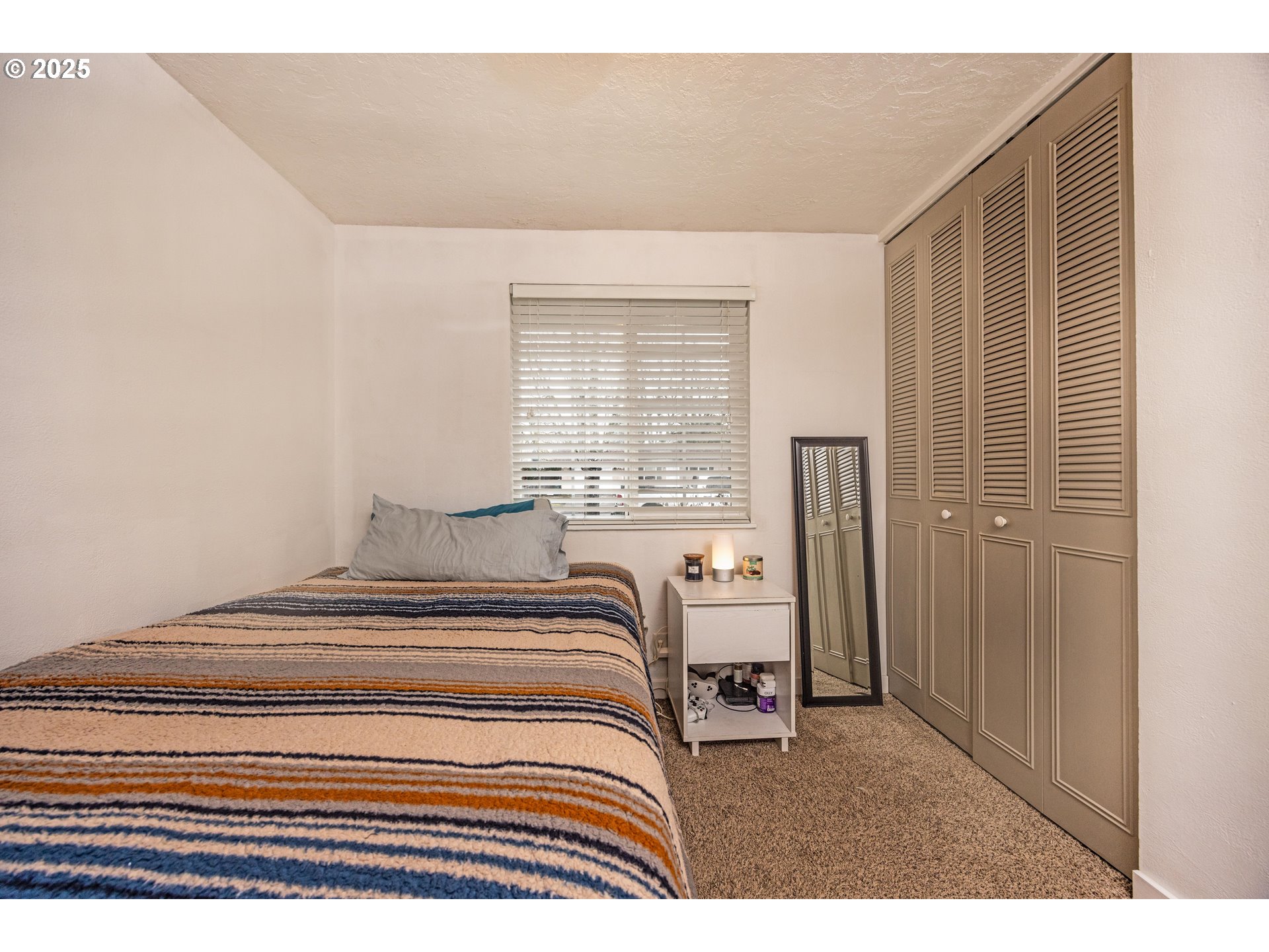 824 56th Street Springfield, OR 97478 - Photo 16 of 31 a bedroom with a bed and a window
