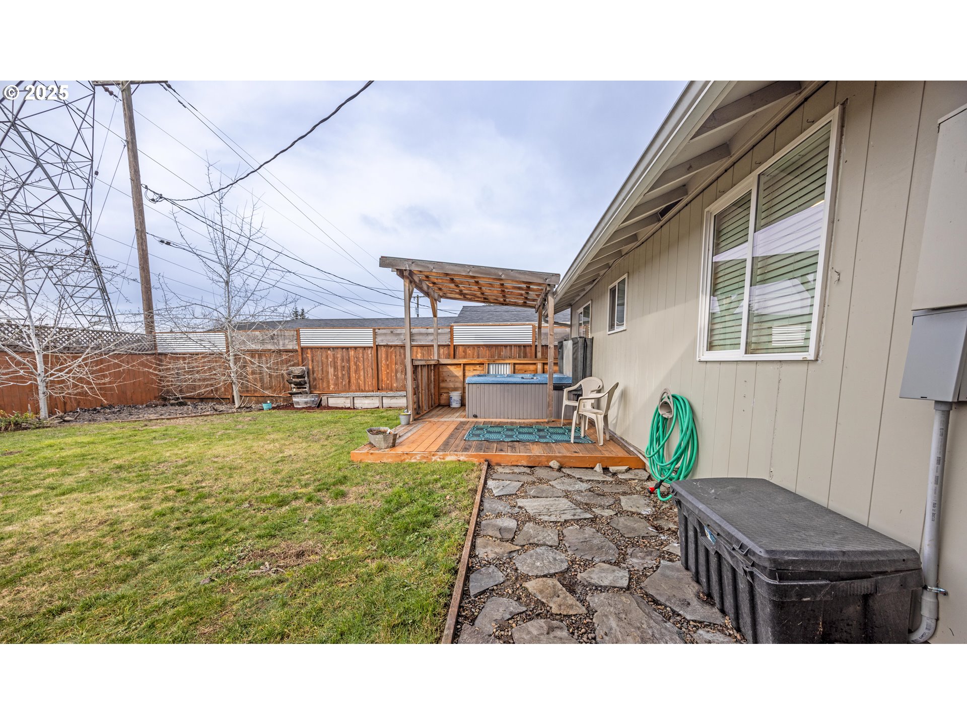824 56th Street Springfield, OR 97478 - Photo 23 of 31 a backyard of a house with table and chairs