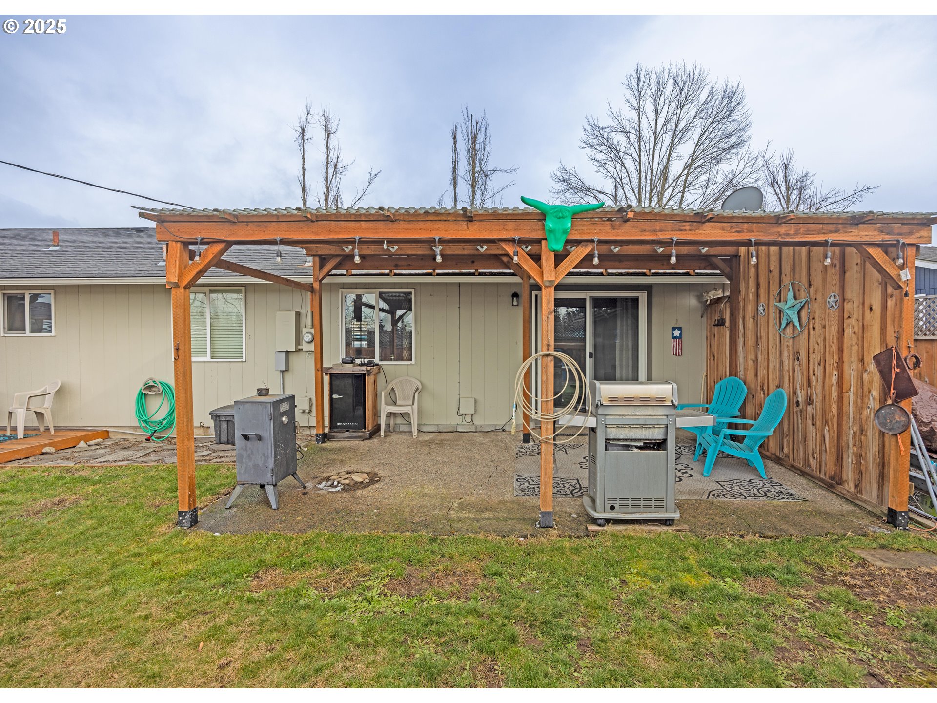 824 56th Street Springfield, OR 97478 - Photo 26 of 31 a front view of a house with patio furniture and garden