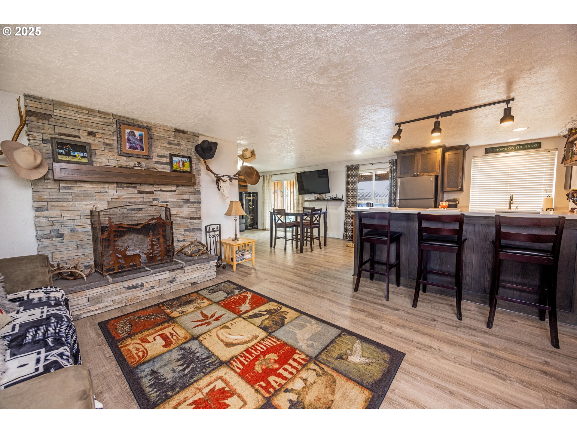 824 56th Street Springfield, OR 97478 - Photo 6 of 31 a living room with furniture a dining table and a fireplace