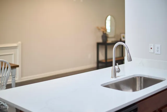 a living room with furniture and stairs