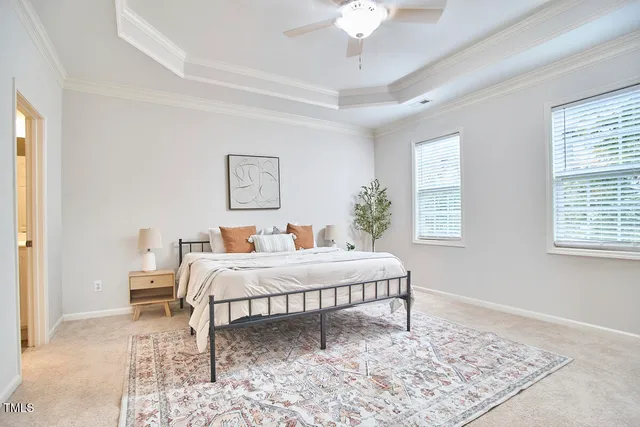 a en suite bathroom with a double vanity sink a mirror and a bathtub