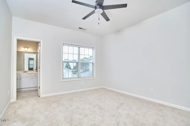 a view of an empty room with a white walls