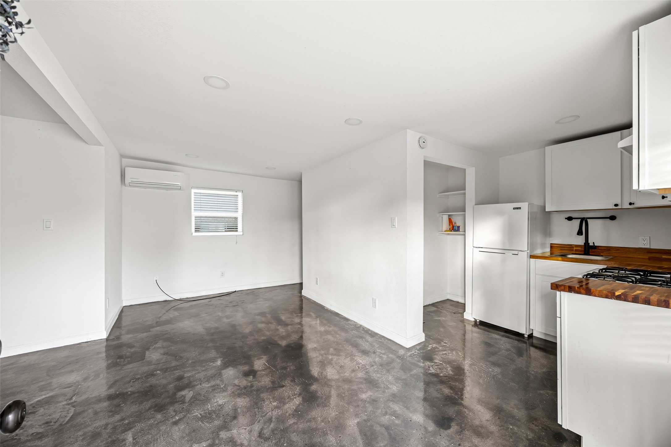 7303 Market Street Houston, TX 77020 - Photo 7 of 18 a kitchen with a refrigerator stove and a sink