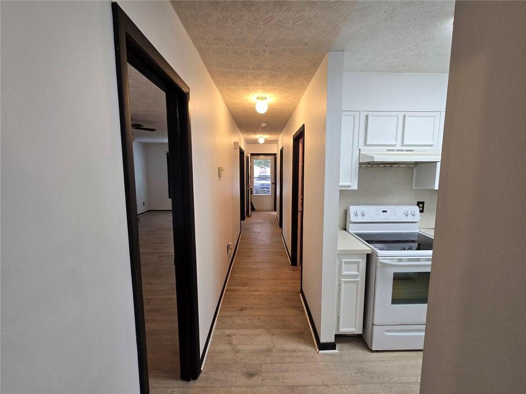 a view of hallway with washer and dryer