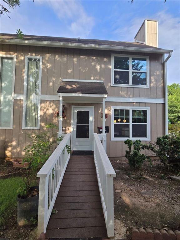 1297 Tree Creek Court Clarkston, GA 30021 - Photo 29 of 31 a front view of a house with a porch
