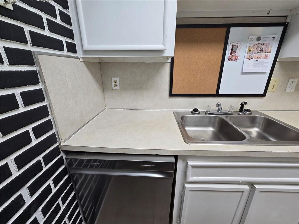 1297 Tree Creek Court Clarkston, GA 30021 - Photo 3 of 31 a bathroom with a sink and a mirror