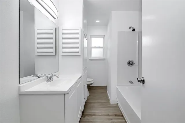 a bathroom with a sink a mirror and a shower