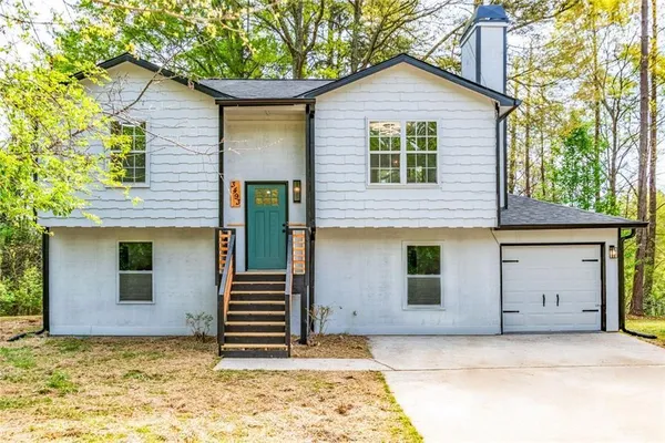 a view of a house with a garage