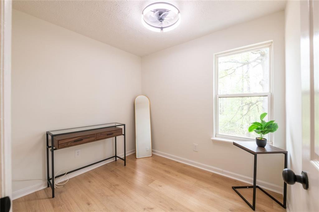 3493 Newberry Trail Decatur, GA 30034 - Photo 28 of 48 a view of an empty room with a window and wooden floor