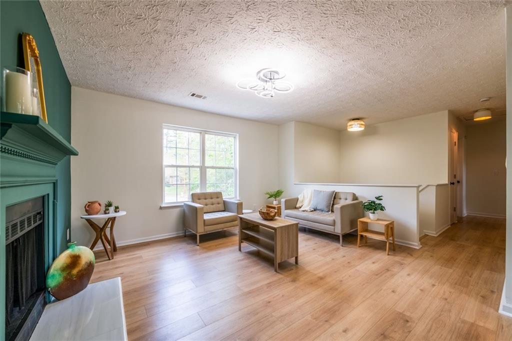3493 Newberry Trail Decatur, GA 30034 - Photo 10 of 48 a living room with furniture and a wooden floor