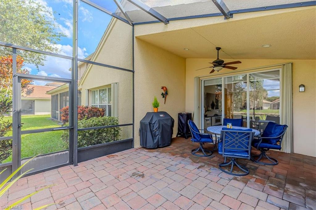 1630 Triangle Palm Terrace Naples, FL 34119 - Photo 22 of 24 a house view with a sitting space and garden space