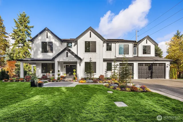 a front view of a house with a yard and porch