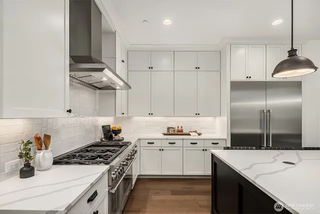 a kitchen with a sink stove and refrigerator