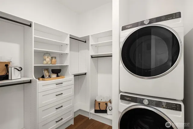 a view of a hallway with washer and dryer