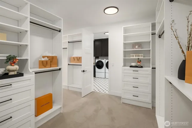 a bathroom with a tub sink shower and mirror