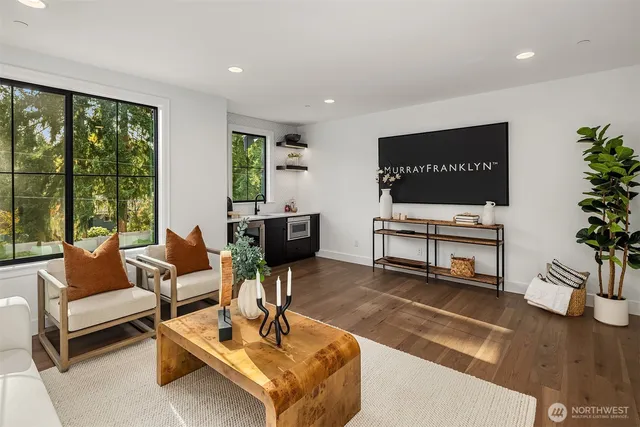 a bedroom with bed and a large window