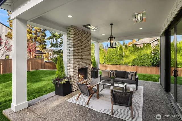 a view of a patio with a table chairs and a backyard