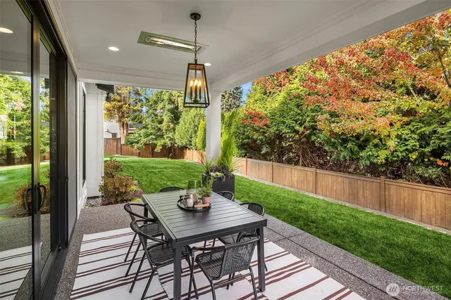 a front view of a house with a yard porch and outdoor seating