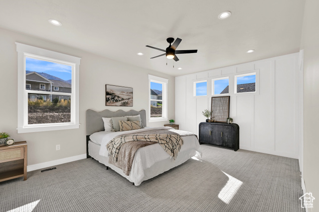 658 West 500 South Logan, UT 84321 - Photo 6 of 25 Bedroom with carpet flooring, multiple windows, recessed lighting, ceiling fan, and a decorative wall