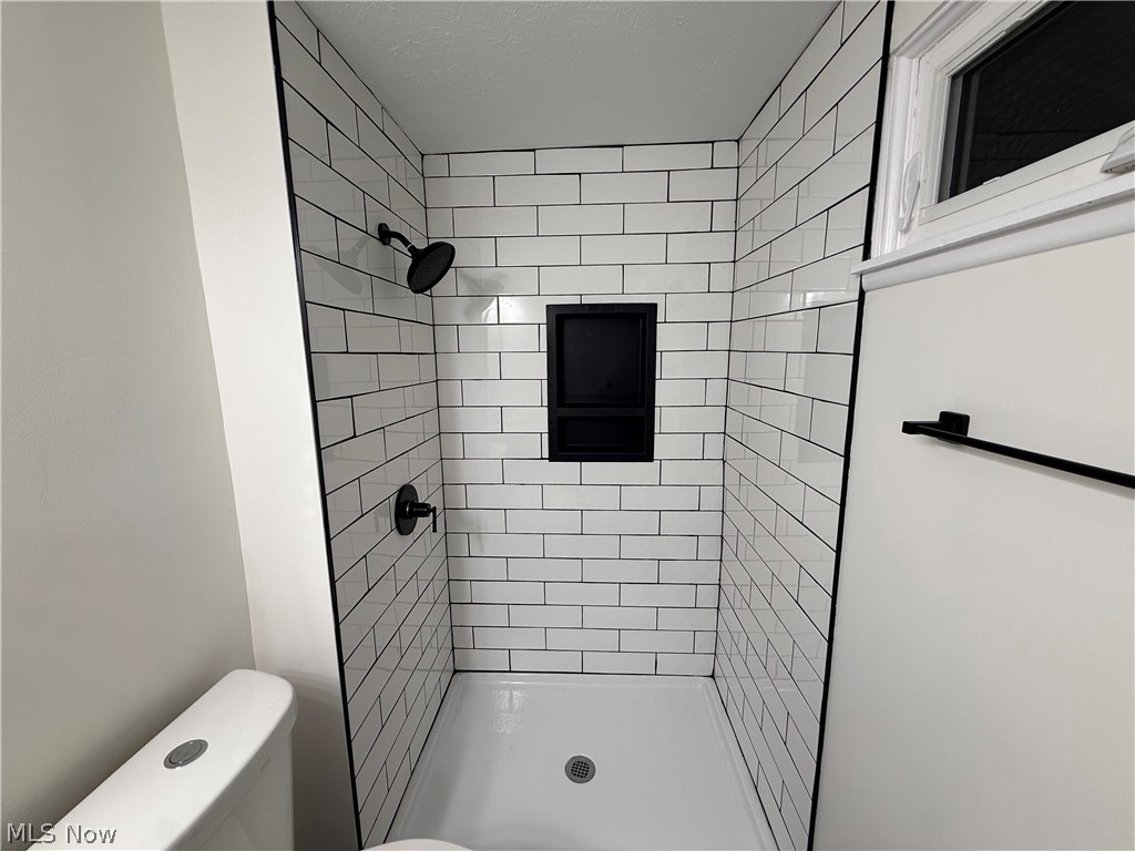 16667 Drake Road Strongsville, OH 44136 - Photo 15 of 30 Full bathroom with a shower stall and toilet