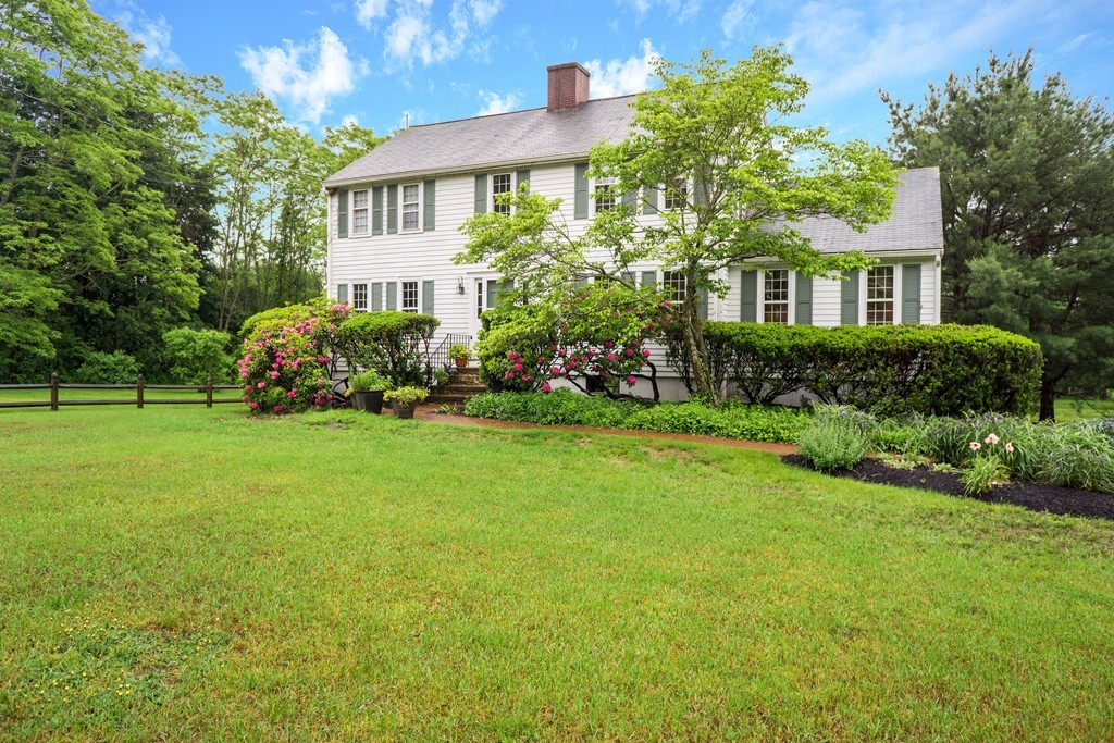 500 Lexington Road Concord, MA 01742 - Photo 1 of 14 a front view of a house with a garden