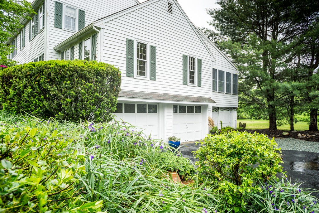 500 Lexington Road Concord, MA 01742 - Photo 12 of 14 a front view of a house with a garden
