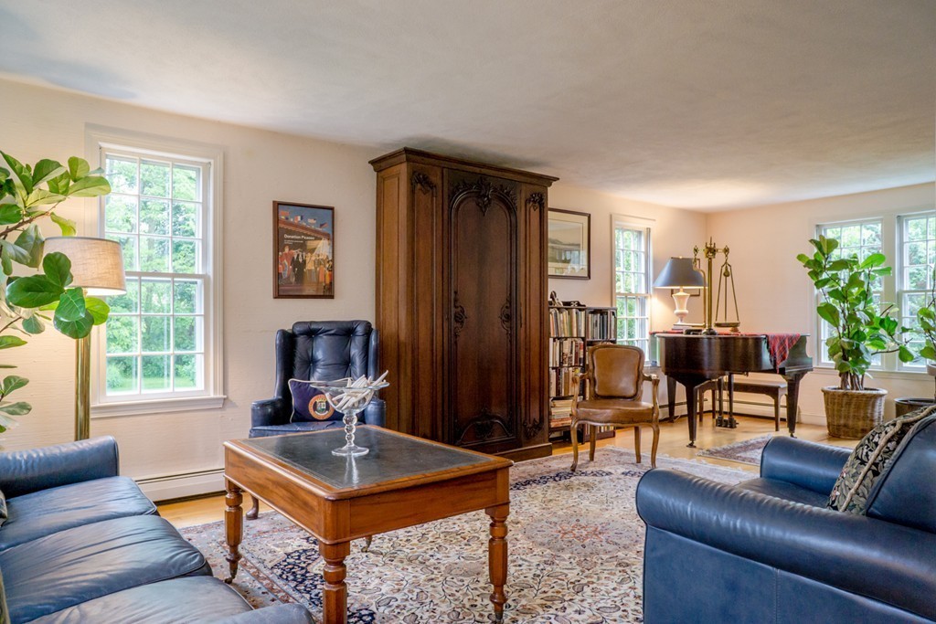 500 Lexington Road Concord, MA 01742 - Photo 3 of 14 a living room with furniture a window and a fireplace