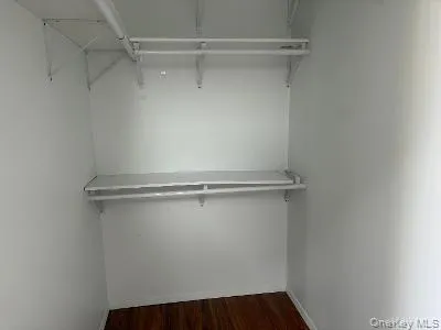 a view of a room with racks on the wall