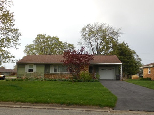 319 West North Street Forrest, IL 61741 - Photo 1 of 18 a front view of a house with a garden