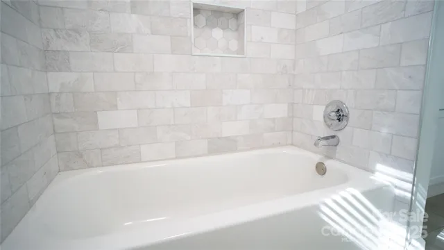 a bathroom with a bathtub