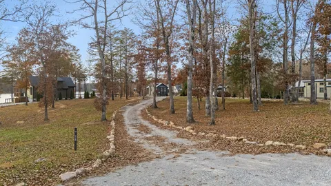 a view of a house with a yard covered with snow