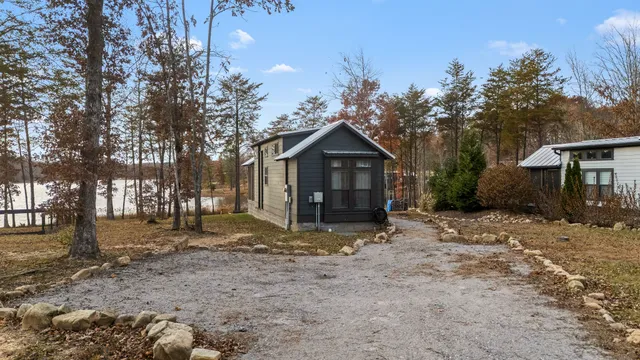 a view of a house with yard and sitting area