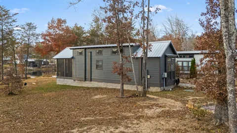 a living room with a large window and a table