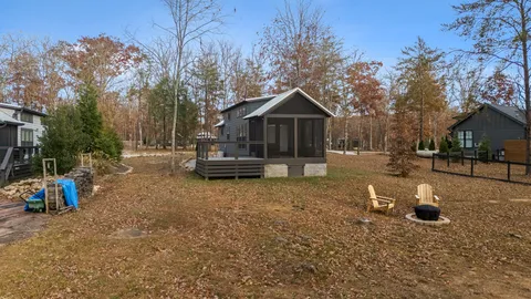 a white toilet sitting next to a shower curtain
