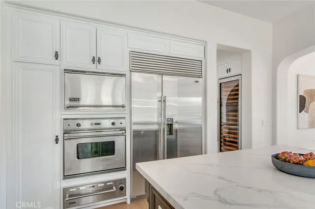 a kitchen with appliances and cabinets